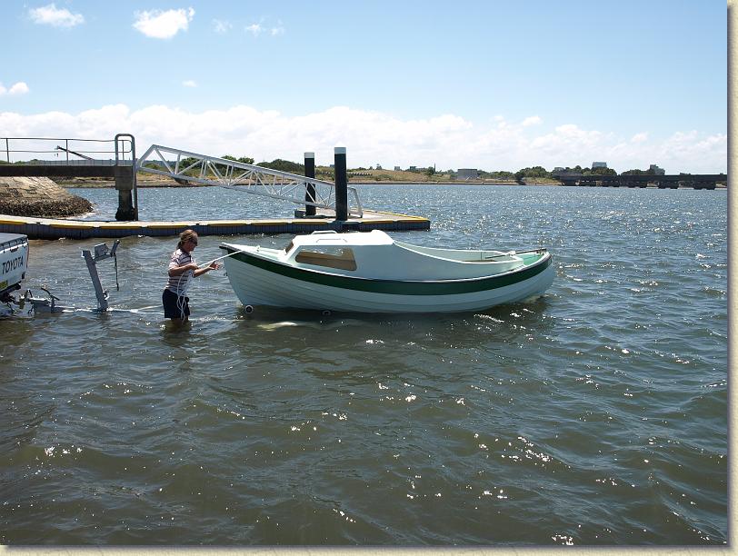 The boat drifts off the trailer