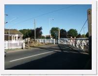pict5527 * (Great Britain, Frinton), Frinton crossing. The gates are manual. He's walking the near gate closed before clearing a mechanical semaphore signal for the train. * 2560 x 1920 * (2.18MB)