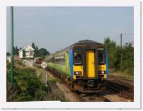 pict5697 * (Great Britain, Norfolk Broads), Wroxham. Our train leaving Wroxham station. The Bure valley narrow guage line is just visible behind the signal box. * 2560 x 1920 * (2.24MB)